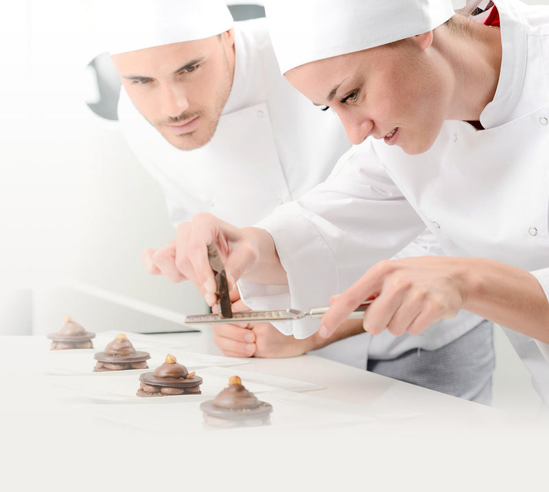 Two Chocolate Chefs creating sweet desert