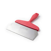Red-handled scraper with metal blade on a white background